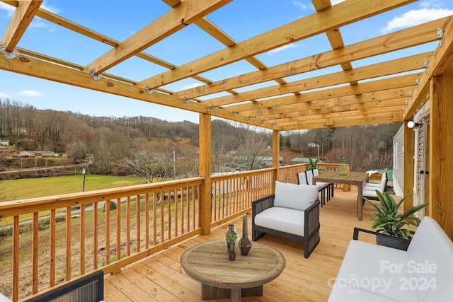 wooden terrace featuring a pergola