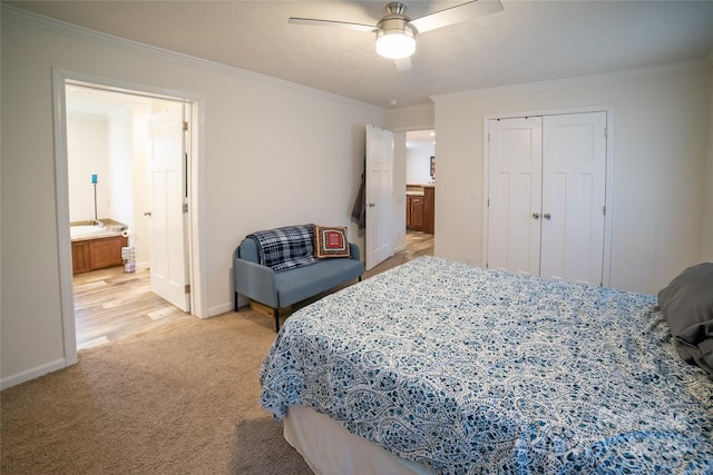 bedroom with ensuite bath, ceiling fan, a closet, and ornamental molding