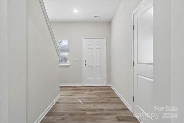 hall with light hardwood / wood-style flooring