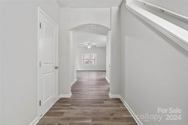 hallway with dark wood-type flooring