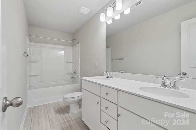 full bathroom with shower / tub combination, vanity, and toilet