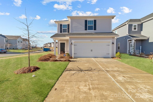 traditional-style house with a garage, concrete driveway, and a front lawn