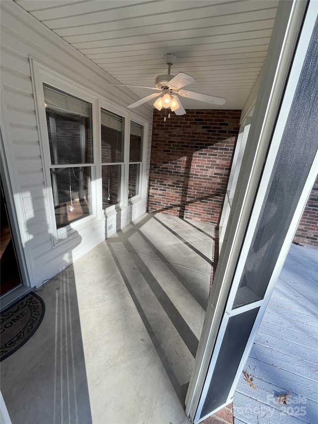 sunroom / solarium with ceiling fan