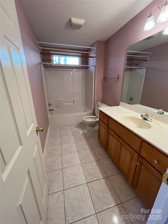 full bathroom with tile patterned floors, vanity, a textured ceiling,  shower combination, and toilet