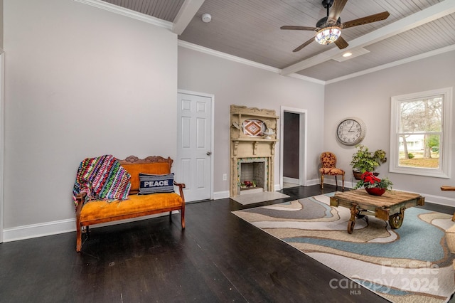 living area featuring ceiling fan, beamed ceiling, crown molding, wood ceiling, and hardwood / wood-style flooring