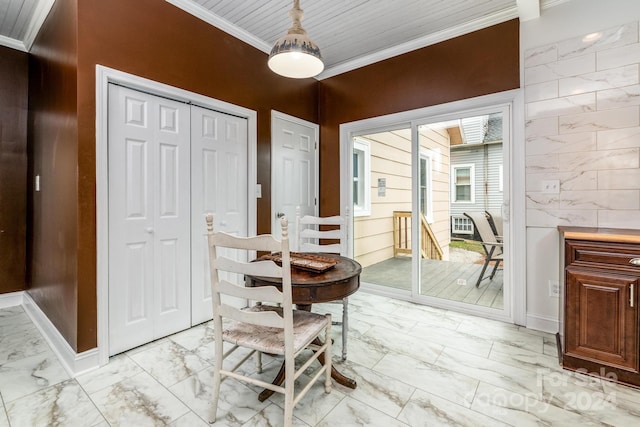 dining space with tile walls and ornamental molding