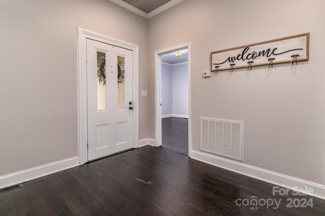 foyer featuring dark hardwood / wood-style floors and ornamental molding