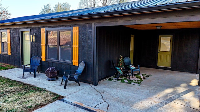 view of patio / terrace featuring an outdoor fire pit