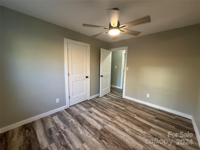 unfurnished bedroom with hardwood / wood-style flooring and ceiling fan