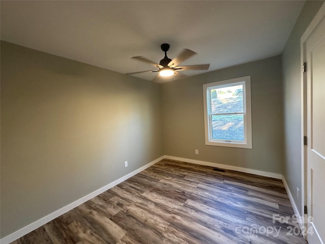 unfurnished room featuring hardwood / wood-style floors and ceiling fan