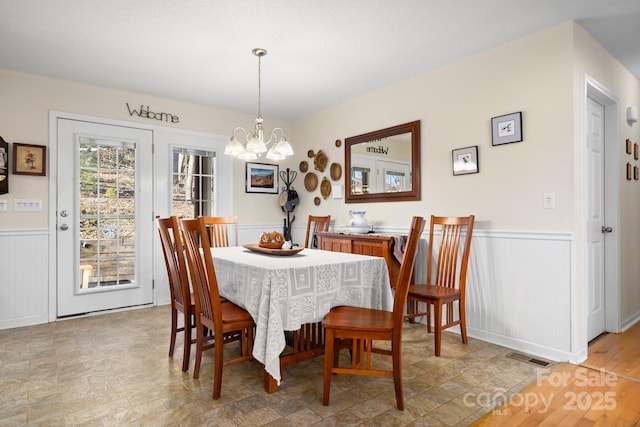 2959/2961 Bearwallow Mountain Rd, Hendersonville, NC 28792 - dining area featuring a chandelier