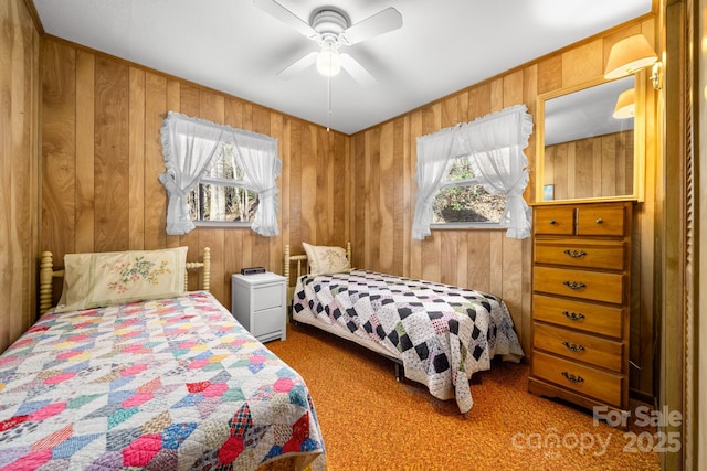 2959/2961 Bearwallow Mountain Rd, Hendersonville, NC 28792 - carpeted bedroom featuring multiple windows, ceiling fan, and wood walls