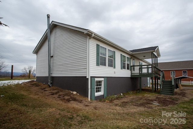 view of side of home featuring a yard