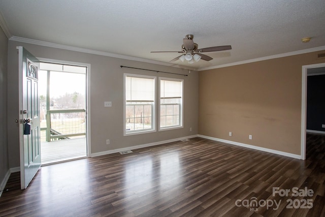 empty room featuring a textured ceiling, dark hardwood / wood-style flooring, ceiling fan, and crown molding