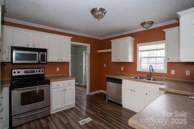 kitchen with white cabinetry, sink, a textured ceiling, and appliances with stainless steel finishes