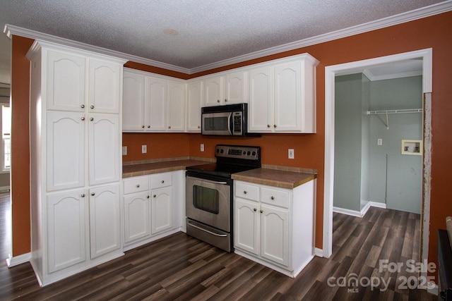 kitchen featuring a textured ceiling, stainless steel appliances, crown molding, white cabinets, and dark hardwood / wood-style floors