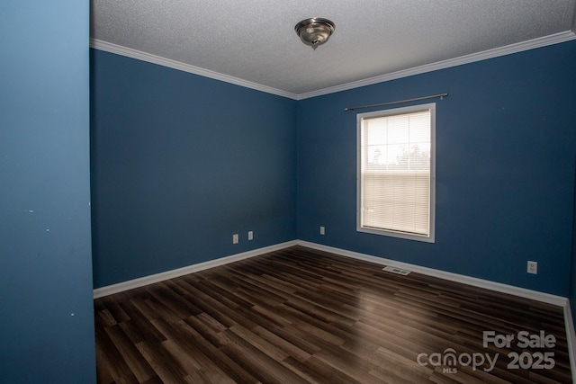 empty room with crown molding, a textured ceiling, and dark wood-type flooring