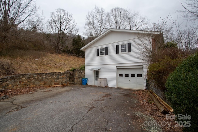 view of side of property with a garage