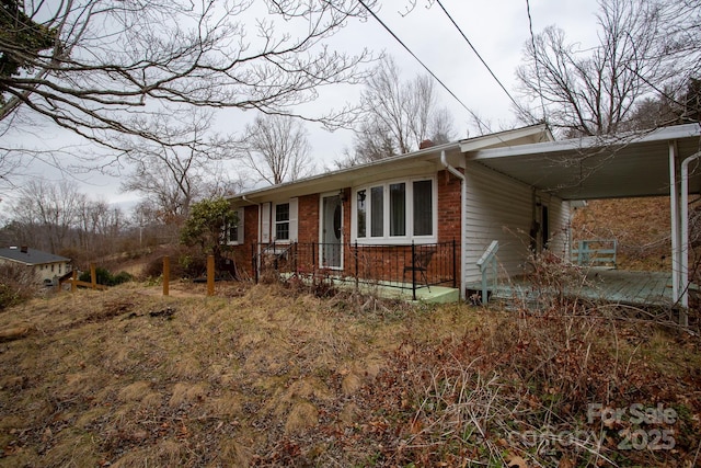 view of front of property with a carport