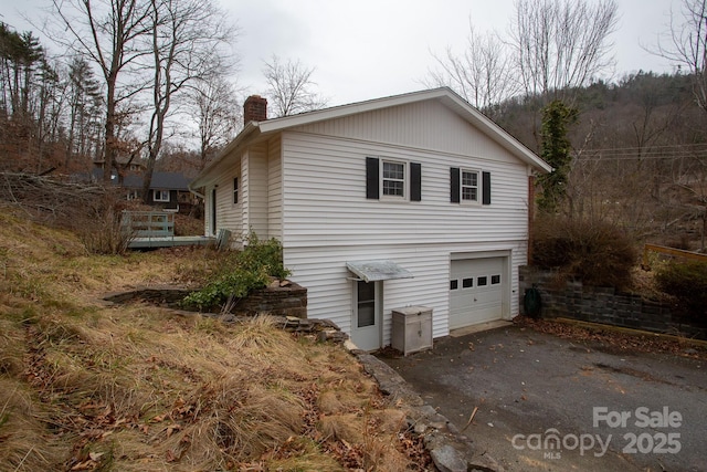 view of side of property featuring a garage