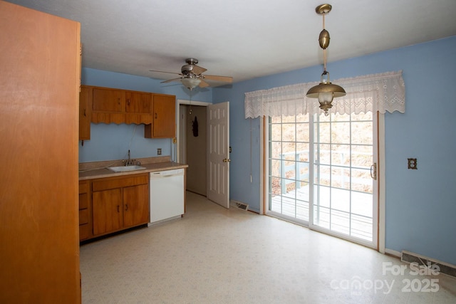 kitchen with dishwasher, sink, pendant lighting, and ceiling fan