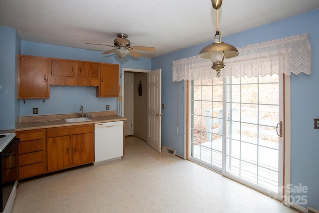 kitchen featuring sink, pendant lighting, white dishwasher, electric stove, and ceiling fan