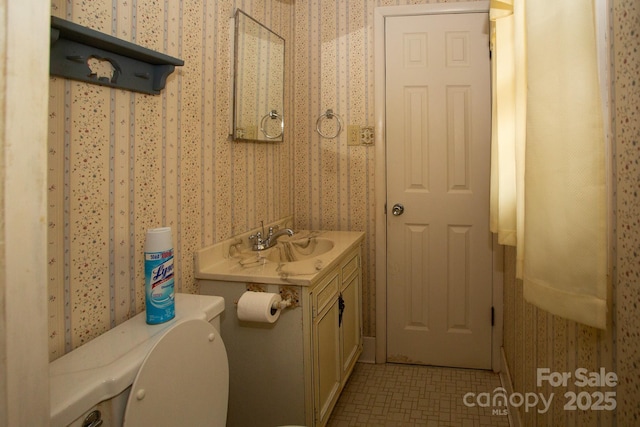 bathroom with vanity and toilet