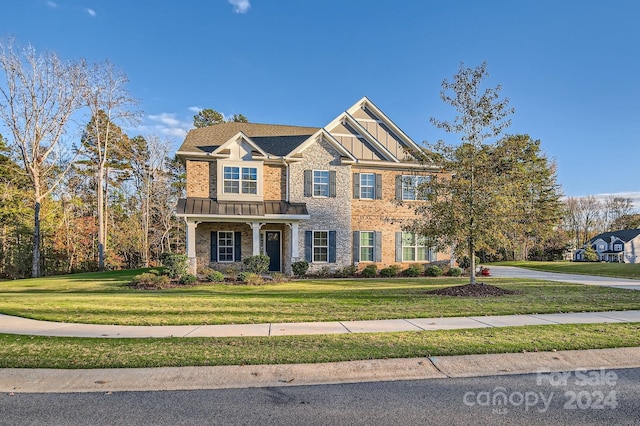 craftsman-style home with a front yard