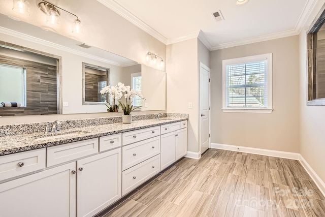 bathroom featuring vanity and crown molding