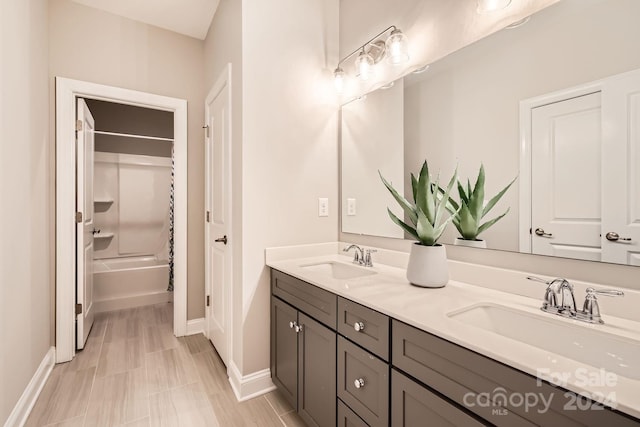 bathroom featuring vanity and bathtub / shower combination