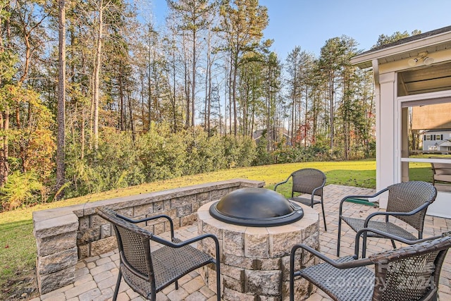 view of patio featuring a fire pit