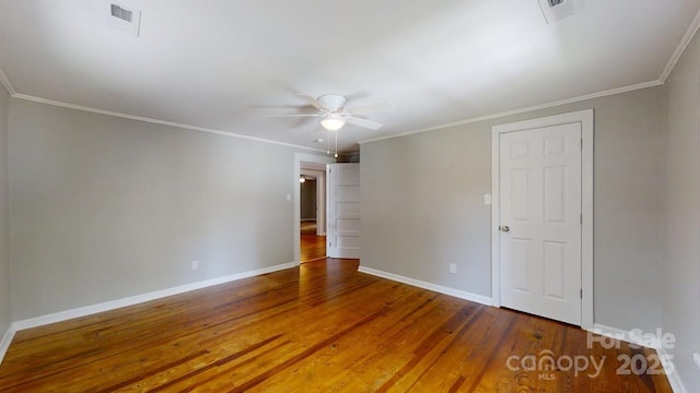 empty room with hardwood / wood-style floors, ceiling fan, and ornamental molding