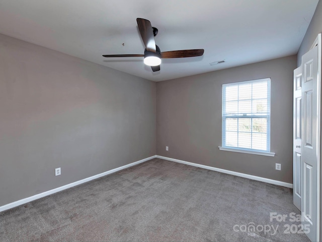 carpeted empty room with ceiling fan