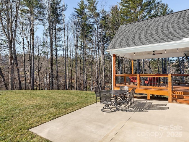 view of patio / terrace with ceiling fan and a deck