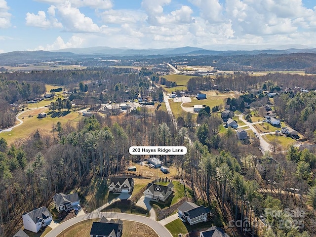 drone / aerial view featuring a mountain view