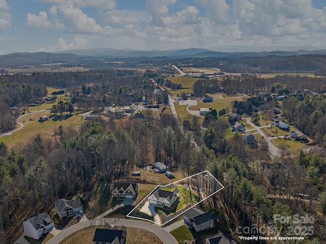 drone / aerial view featuring a mountain view