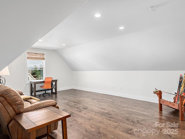 living area with lofted ceiling and dark wood-type flooring