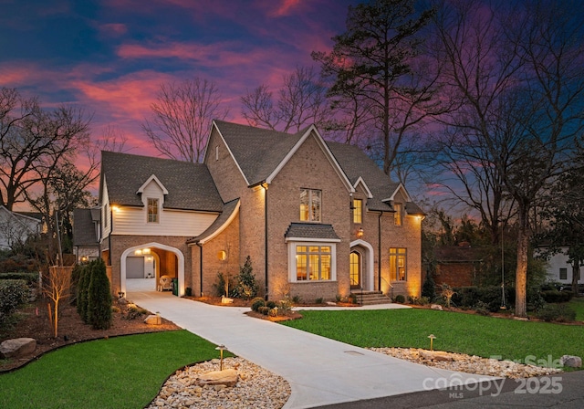 view of front of property with a yard