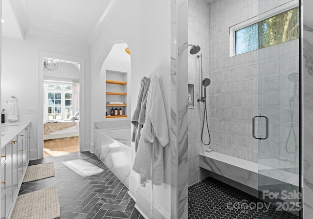 bathroom featuring vanity, crown molding, and walk in shower