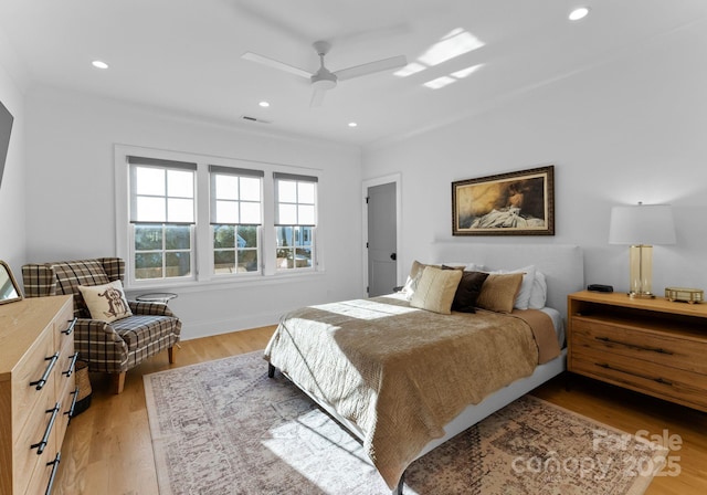 bedroom featuring visible vents, recessed lighting, a ceiling fan, and light wood-style floors