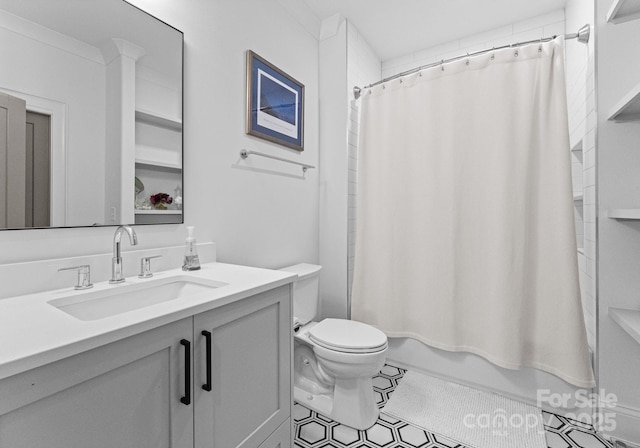 full bathroom featuring toilet, vanity, shower / bath combination with curtain, and ornamental molding