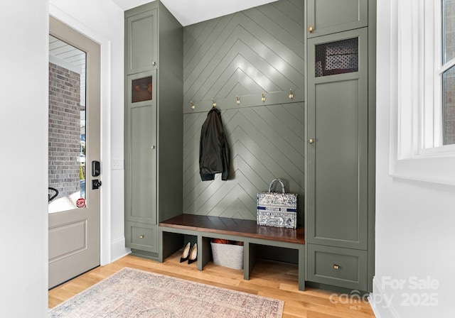 mudroom with light hardwood / wood-style flooring