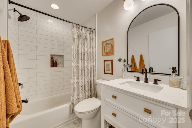 full bathroom with vanity, shower / bath combination with curtain, and toilet