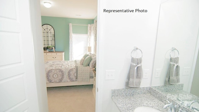 bedroom with carpet flooring and sink