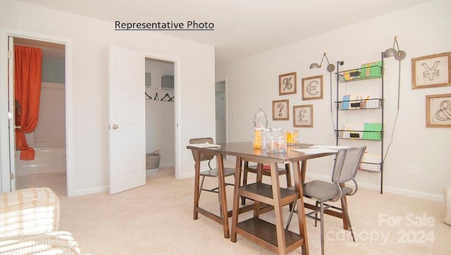 view of carpeted dining space