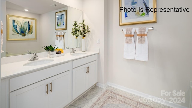 bathroom with tile patterned floors and vanity