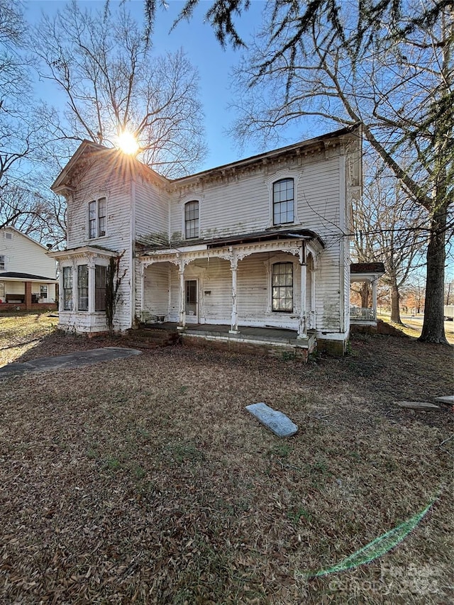 italianate-style house with covered porch