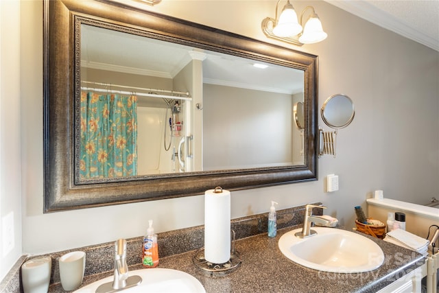 bathroom featuring a shower with curtain, vanity, and ornamental molding