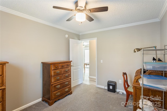 carpeted home office featuring ceiling fan, a textured ceiling, and ornamental molding