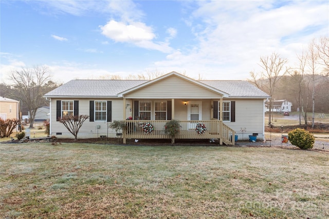 ranch-style house featuring a porch and a front lawn